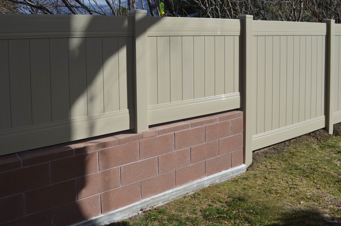 Block Retaining Wall with Vinyl Fence